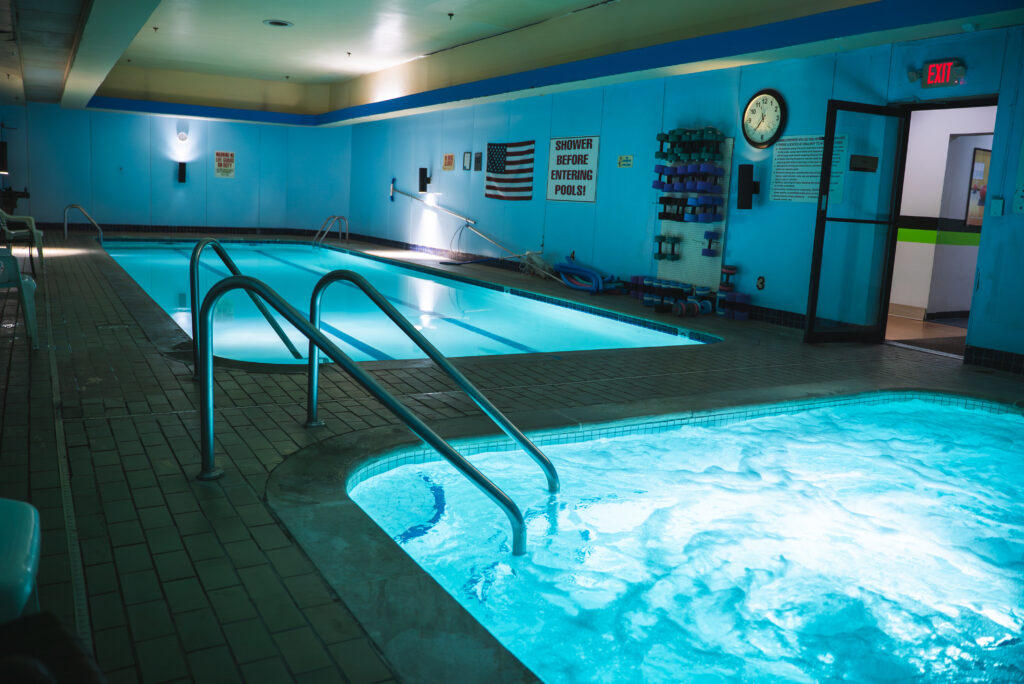 Indoor heated pool and hot tub at Nashville MMA Training Camp, ideal for exercise, recovery, cardio workouts, and water aerobics. Perfect for senior fitness and promoting health benefits